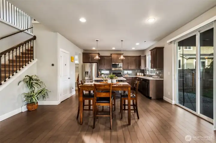 Generous dining area with easy access to generous covered patio and backyard.