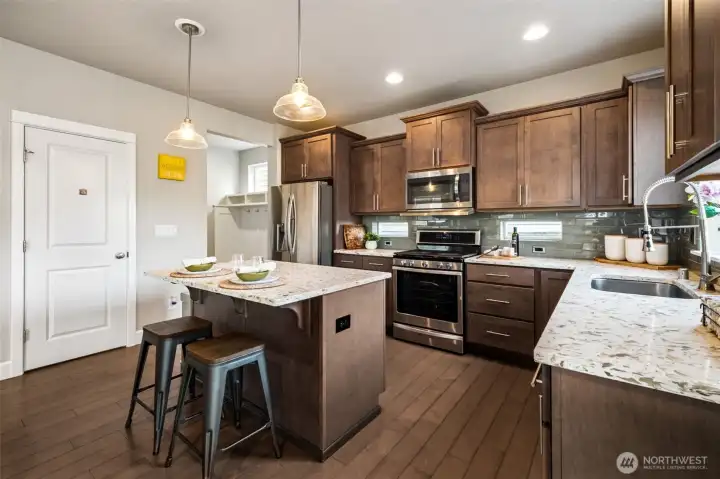 This kitchen has plenty of counter space and bar seating!