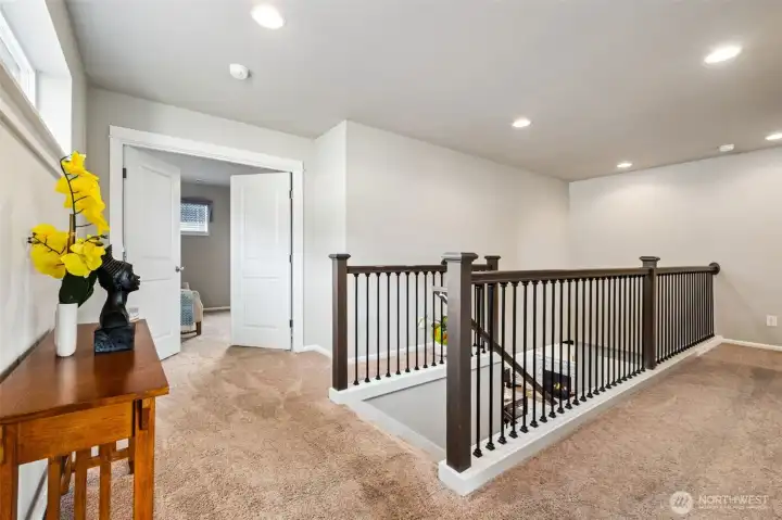 Spacious upper landing that can serve as a reading nook, desk space, or bonus area.
