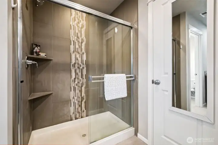 Beautiful tiled shower with modern finishes for a fresh, on-trend look.