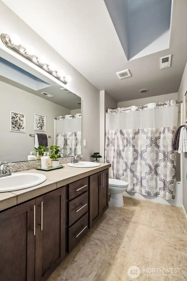 Spacious bath with dual sinks and plenty of storage for busy mornings.