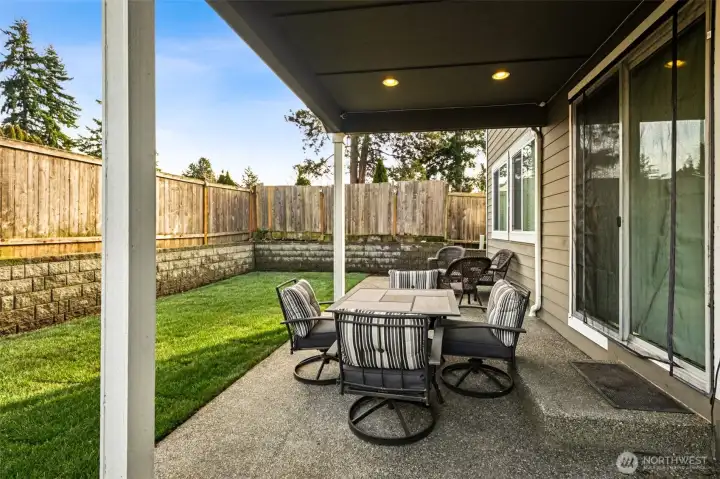 Large 300 sqft covered patio perfect for outdoor dining and year-round entertaining.