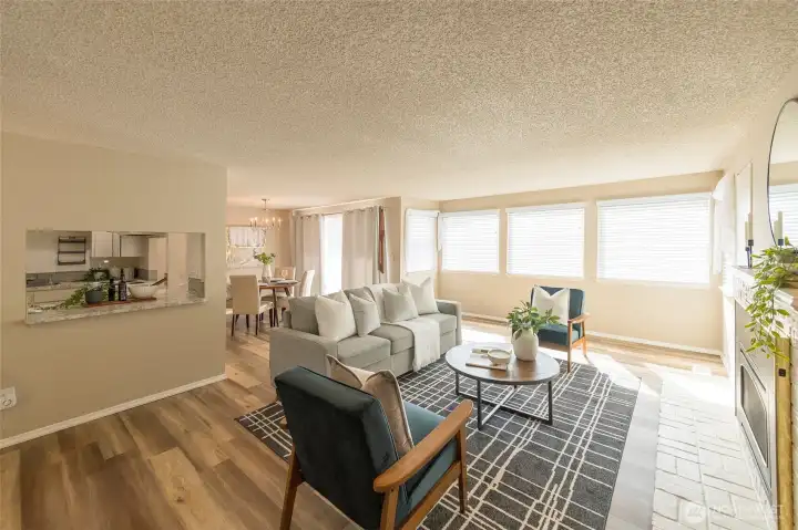 Light-filled living room with large picture windows.