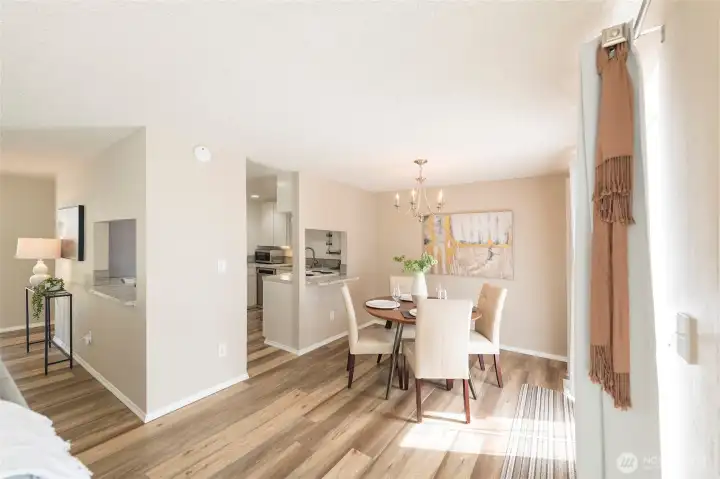 Open-concept dining flows effortlessly into the kitchen.