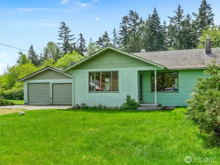 1950's home on 3.18 acres in city limits.