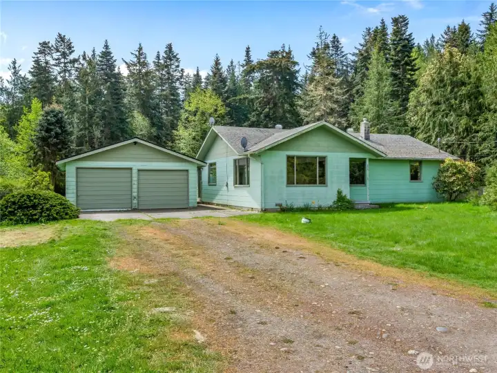 Two car detached garage and ample space for parking.