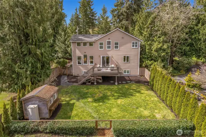 Fully fenced, level backyard with shed, where memories are made.