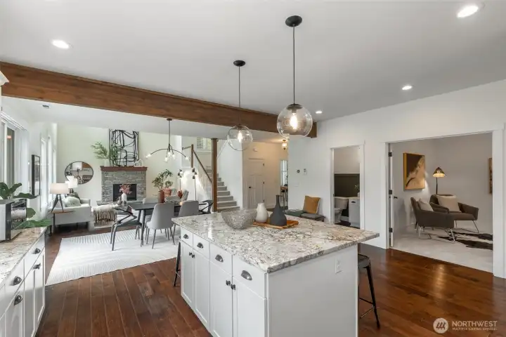 The inviting great room showcases a two-chef granite kitchen, cozy gas fireplace
