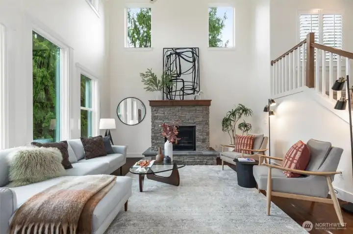 The inviting great room showcases a two-chef granite kitchen, cozy gas fireplace