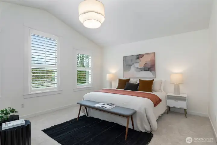 Unwind in the spacious primary suite with tranquil water views, a massive walk-in closet, and a luxurious ensuite.