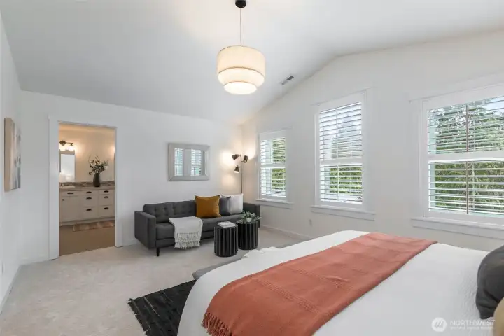 Unwind in the spacious primary suite with tranquil water views, a massive walk-in closet, and a luxurious ensuite.