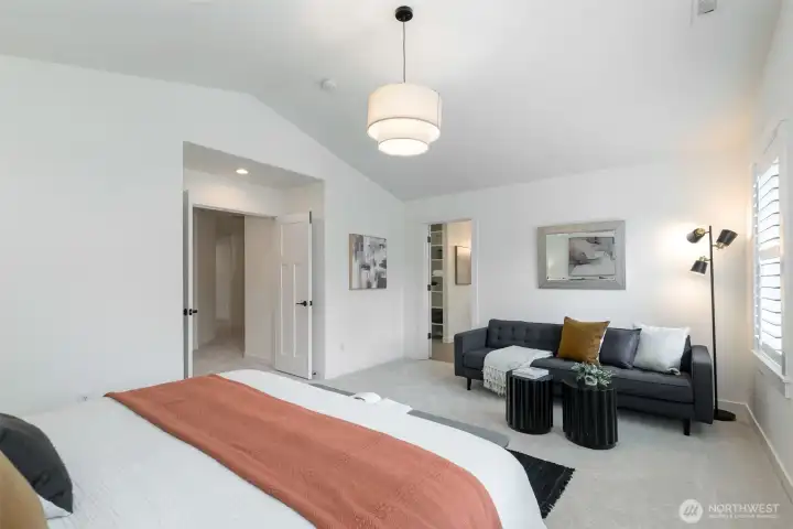 Unwind in the spacious primary suite with tranquil water views, a massive walk-in closet, and a luxurious ensuite.