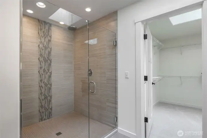 Unwind in the spacious primary suite with tranquil water views, a massive walk-in closet, and a luxurious ensuite.