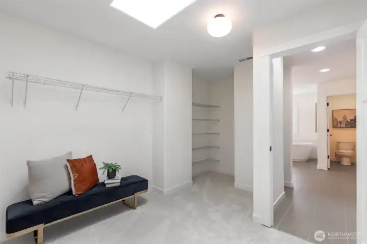 Unwind in the spacious primary suite with tranquil water views, a massive walk-in closet, and a luxurious ensuite.
