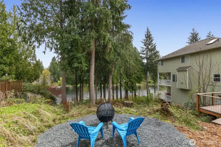 Wander down the path and gather around the firepit, relax on the peaceful side deck, or enjoy your private natural shoreline.