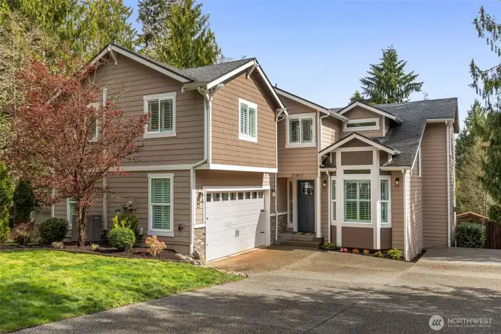 A 2-car garage and extended driveway provide ample space for vehicles and toys.