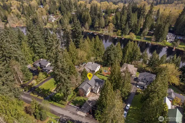 LAKE LIVING at its finest in this exceptional custom NW Craftsman,  thoughtfully refreshed home with new carpet, fresh paint, and stylish lighting is a rare turnkey waterfront opportunity