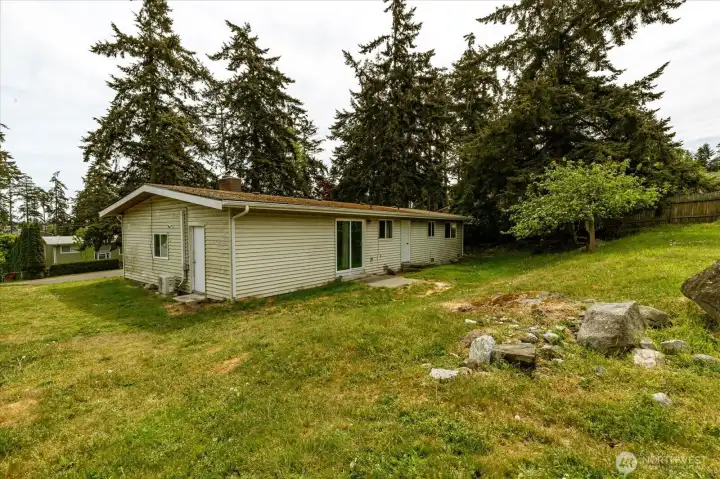 Spacious yard-door leads into garage space.