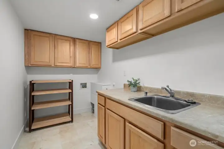 Spacious Laundry Room with lots of cupboards and storage Spacious Laundry Room with lots of cupboards and storage