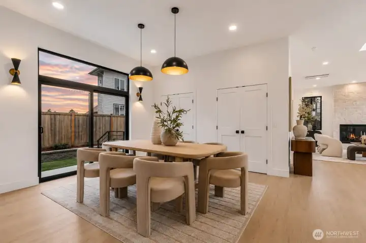 Dining opening up to the outdoor patio lounge