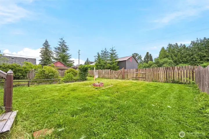 Fully fenced backyard with firepit Fully fenced backyard with firepit