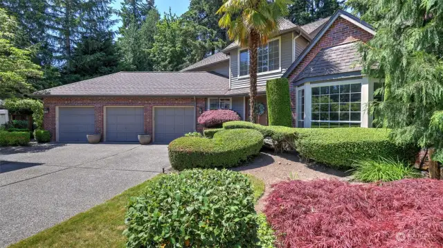 Beautiful landscaped yard, 3-car wide garage and tons of parking.