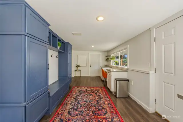 Mud Room with built in for coats, shoes, backpacks and an outside entrance door