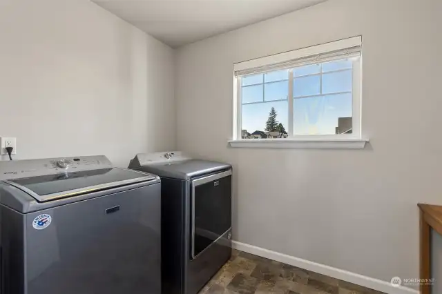 Large laundry room has additional space to add storage