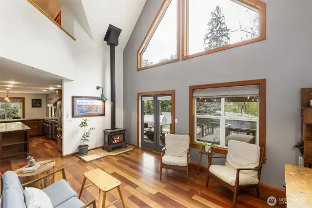 Toasty free-standing wood stove. Living room flows to the kitchen.