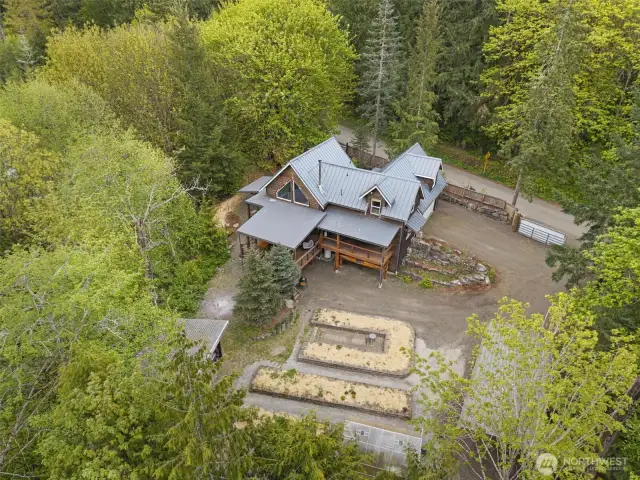 Spacious 1.12 acres bordered by Lucas and Coulter Creeks, this is a truly lovely and unique property.