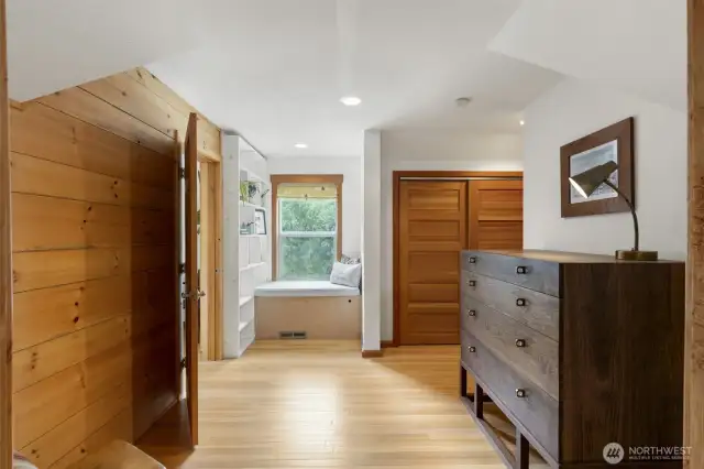 This is a great area that is an extension of the primary suite: office to left, window seat makes a great reading nook!