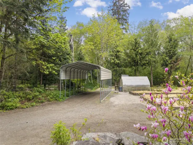 RV parking, raised beds, greenhouse, outbuildings, 2 treehouses and 2 creeks on the property!