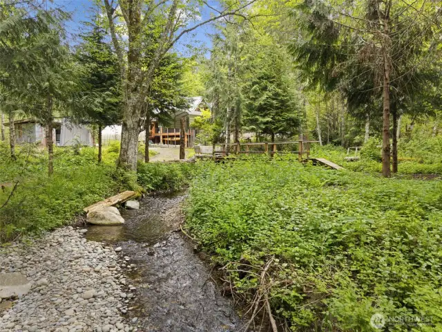 Lovely creekside property with bridges and paths to explore.