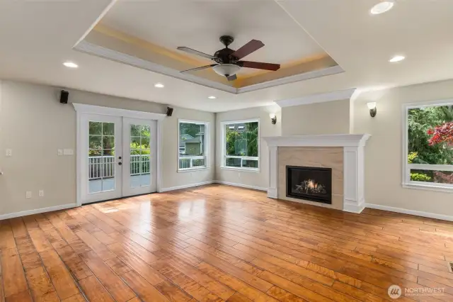 French doors leading out to Trex deck, and large windows providing ample natural light in the living space.