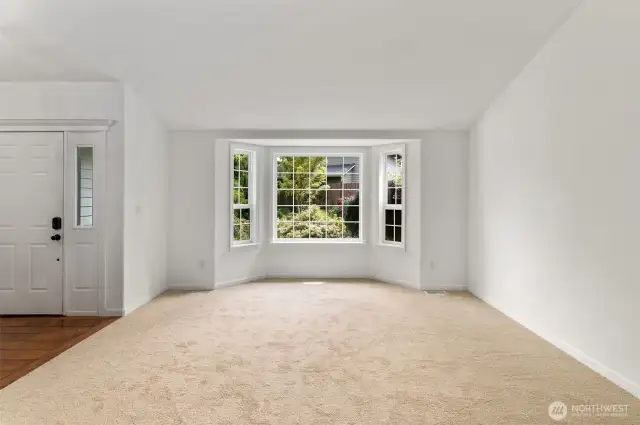 Entry way with Engineered hardwood and brand new carpet.