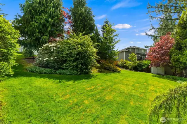 Another view of the lower lawn, with included outbuilding.