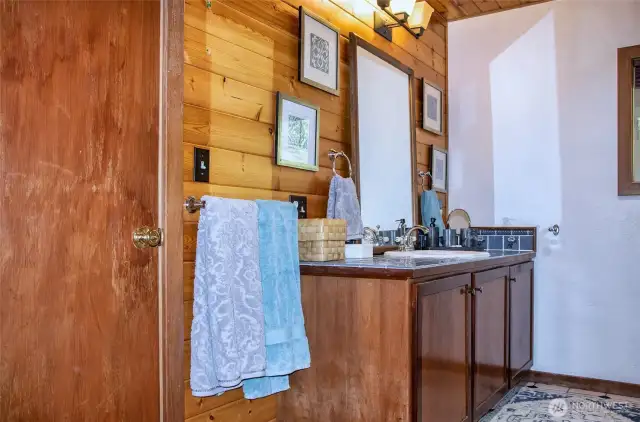 Full bath off hallway and into guest room