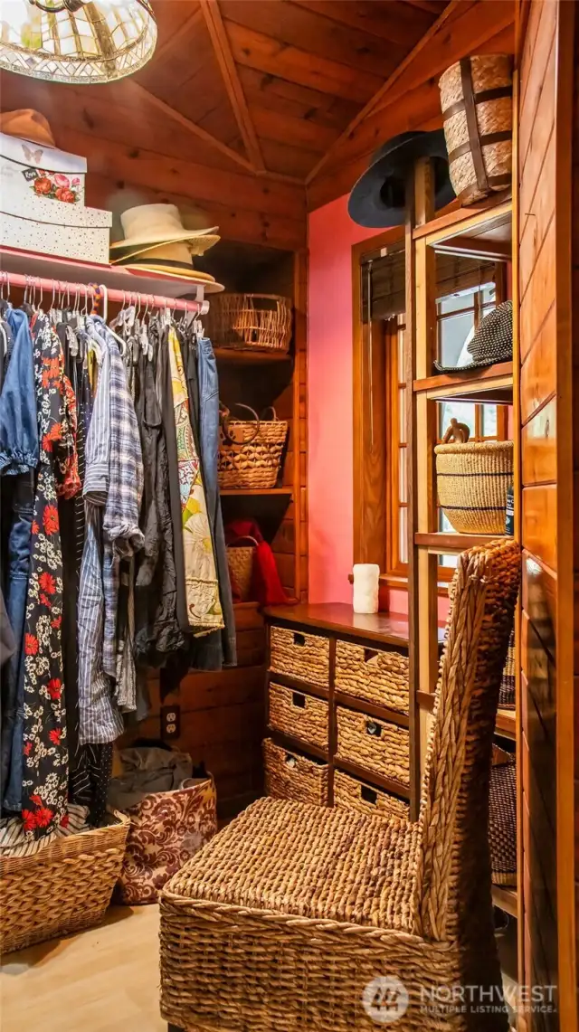 Dressing closet around corner from primary bedroom