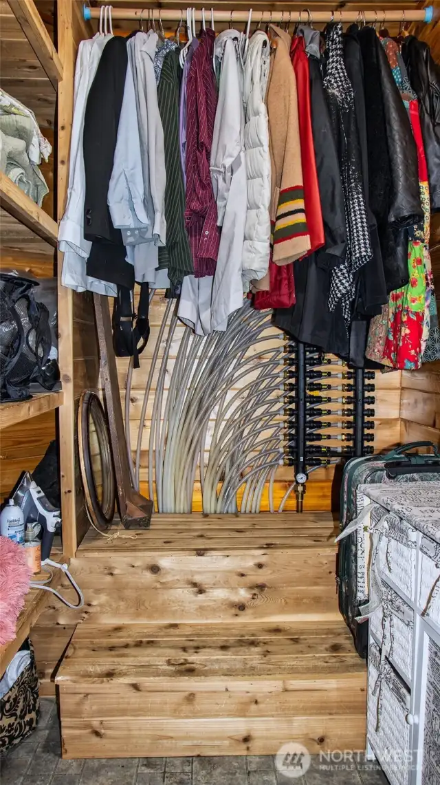 Radiant floor distribution system housed in hallway closet