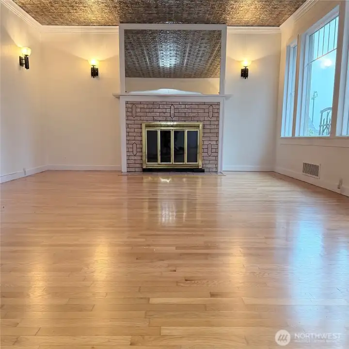 The hardwood floors on this main floor are stunning! Note the tin ceiling.