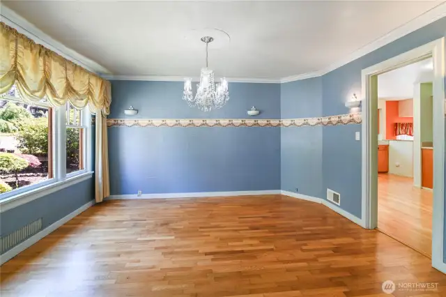 Dining room off of the living room leads into the kitchen.