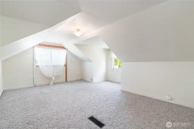 Living space upstairs. The window used to be the door to access the apartment before the garage was built.