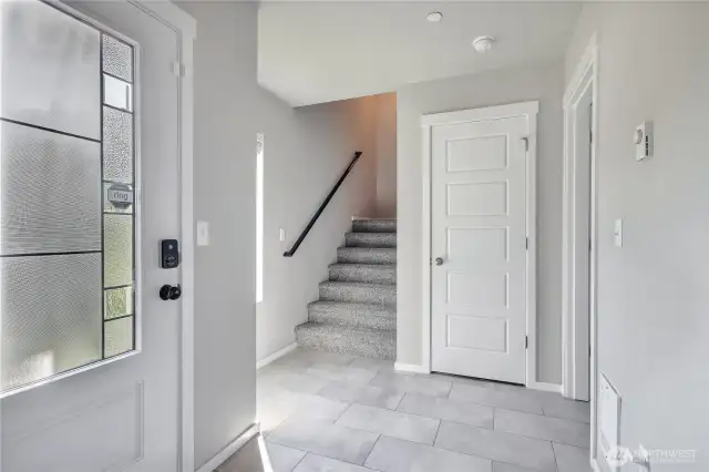 Entrance foyer with garage access and large storage.