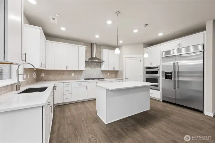 Great entertaining kitchen!  48" counter depth side by side built in refrigerator, gas cooktop, very open to great room ~