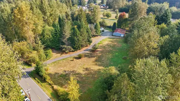 GATED ENTRY, WITH PASTURE AREA, SHOP, RV PARKING.
