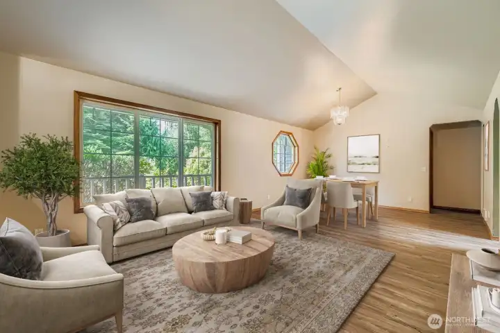 OPEN AND INVITING LIVING ROOM WITH PLENTY OF ROOM FOR FURNITURE, FRIENDS, AND FUN.