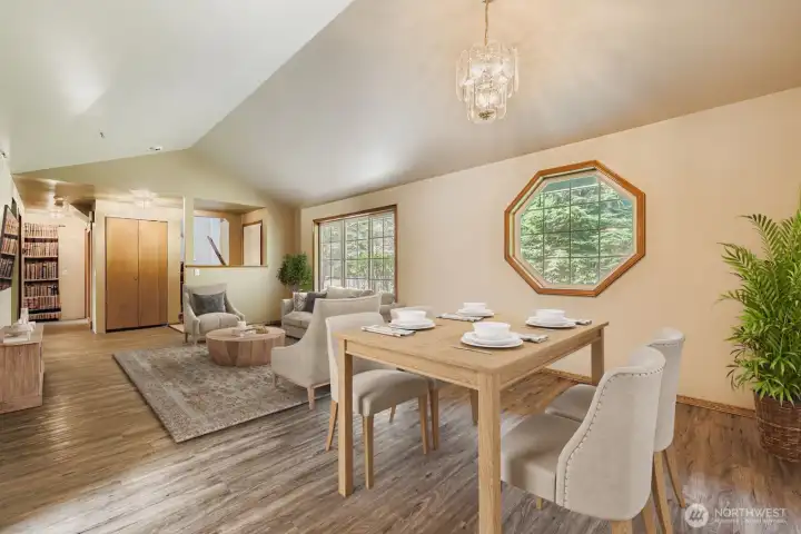 ATTRACTIVE LIVING ROOM, WITH VAULTED CEILINGS AND BRIGHT WINDOWS.