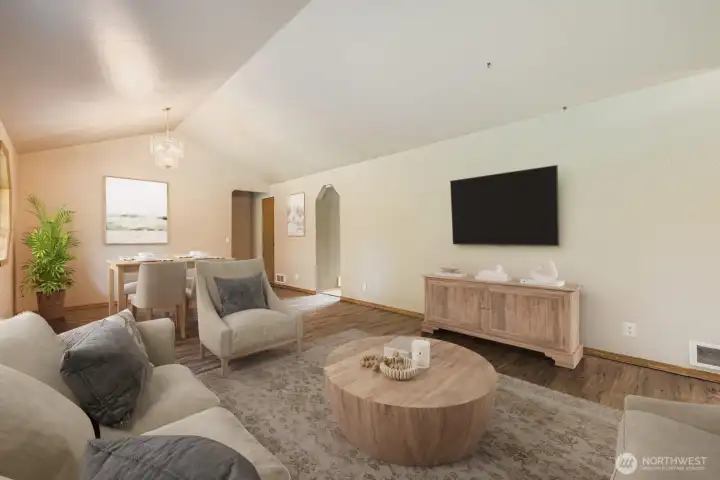 BRIGHT AND PLEASANT LIVING ROOM WITH ABUNDANT NATURAL LIGHT.
