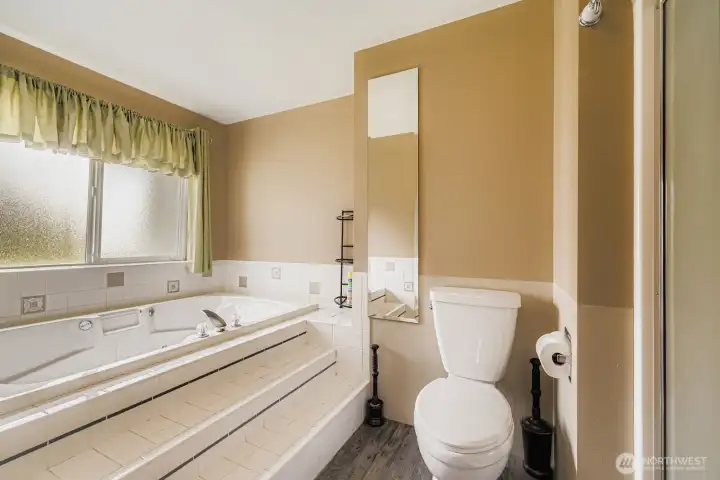 CONVENIENT AND PRIVATE BATHROOM OFF PRIMARY BEDROOM.