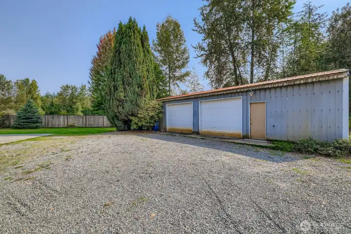 1,152 SF SHOP W/ POWER, DUAL ROLL-UP DOORS & 528 SF COVERED STORAGE AREA.
